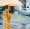 A child with an umbrella