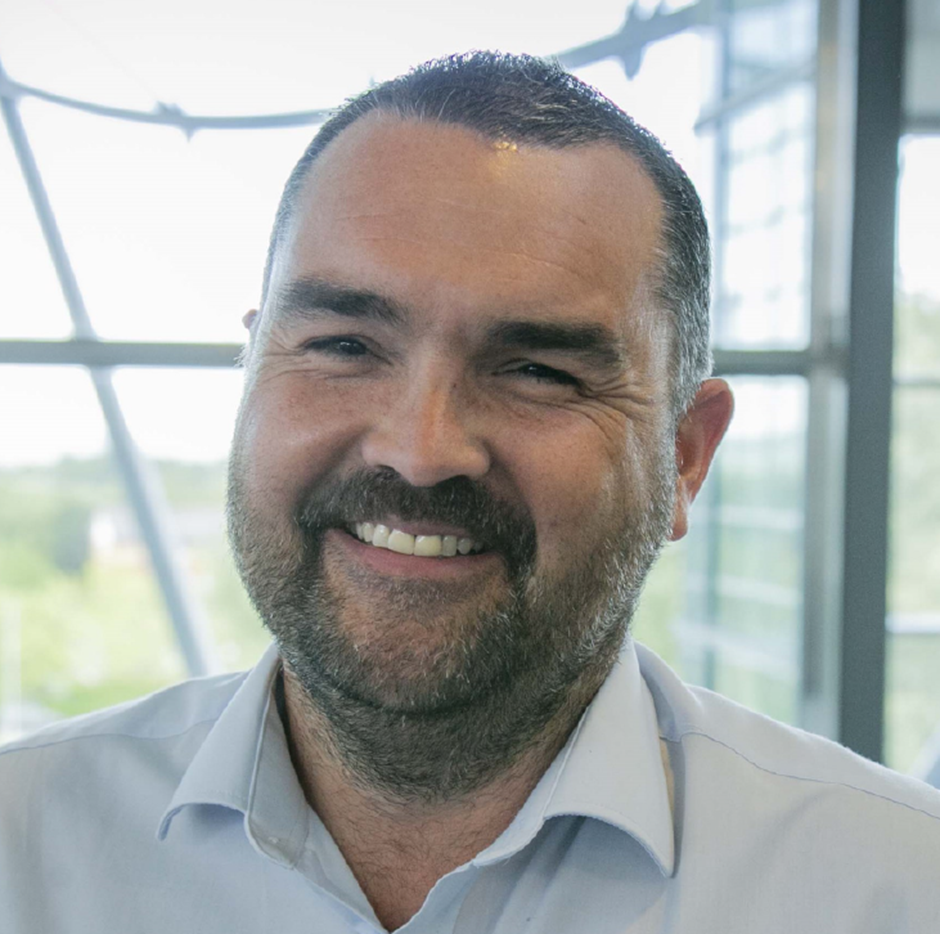 A corporate headshot of Richard Bevan, Met Office Director of Services