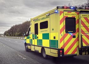 ambulance-driving-along-road