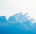 blue-clouds-sitting-beneath-a-bright-sky