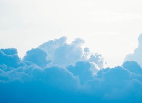 blue-clouds-sitting-beneath-a-bright-sky