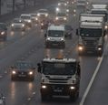 cars-and-lorries-on-busy-wet-road