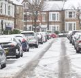 cars-parked-along-a-snow-covered-street