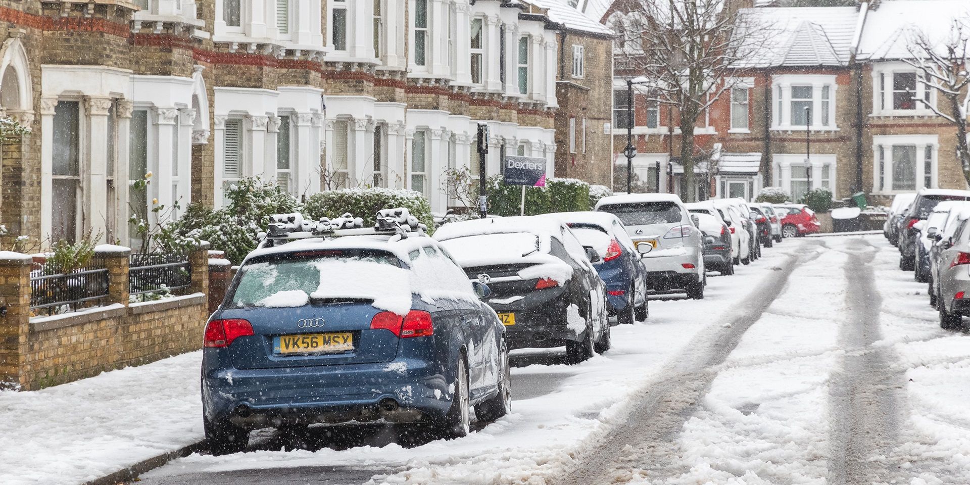cars-parked-along-a-snow-covered-street
