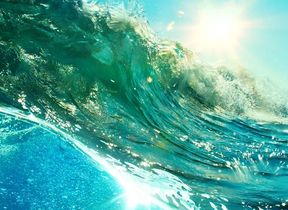 close-up-of-ocean-wave-reflecting-sunshine
