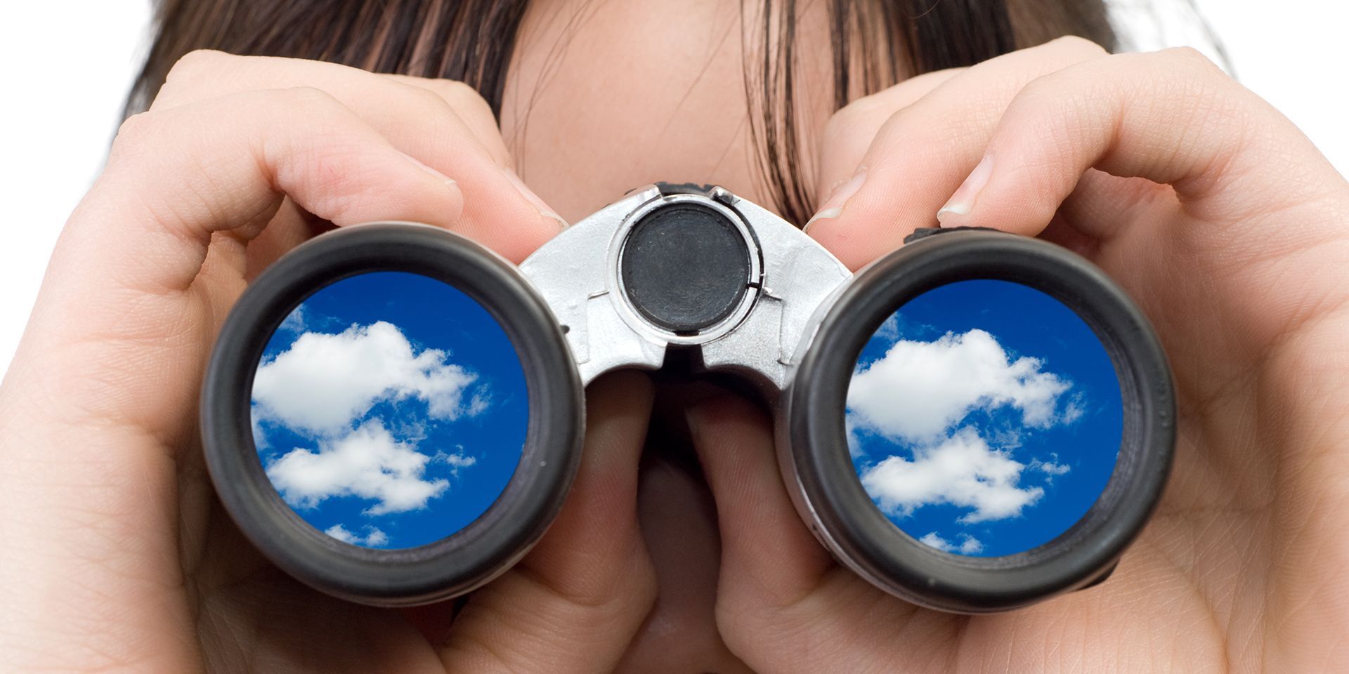 A person holding binoculars and watching clouds