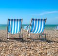 deckchairs-set-up-on-a-beach