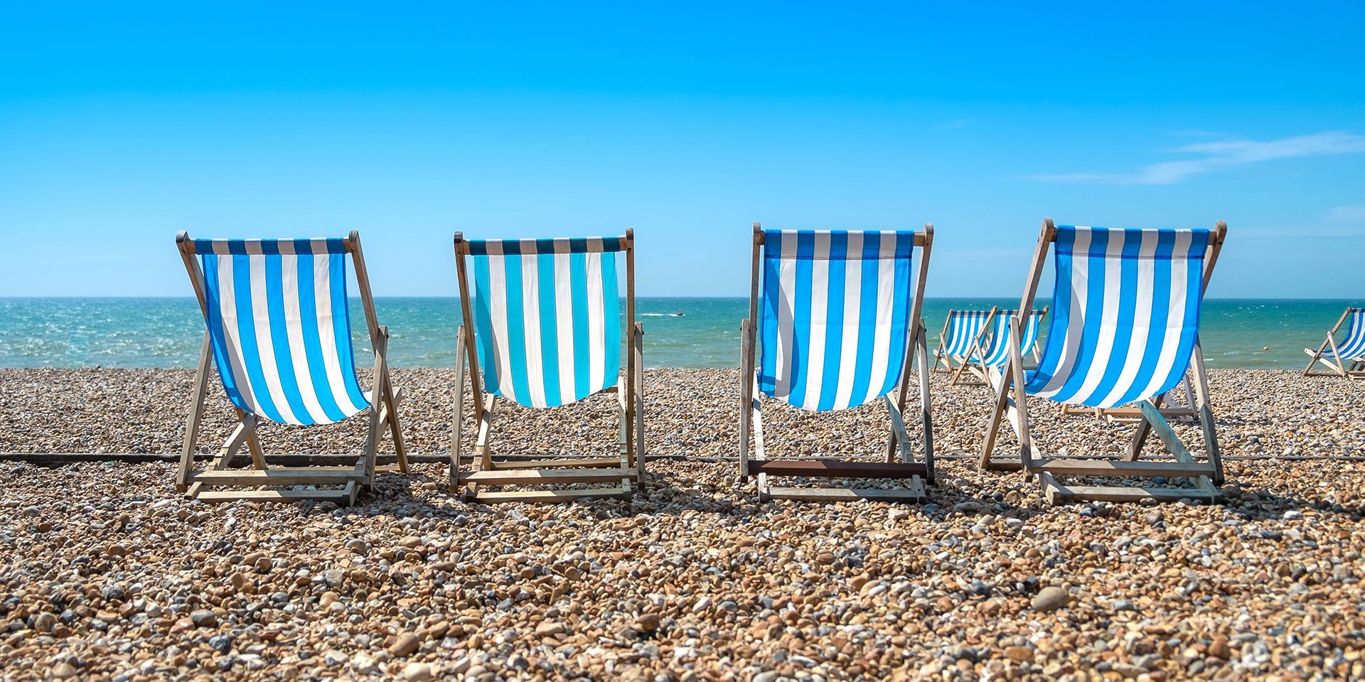 deckchairs-set-up-on-a-beach