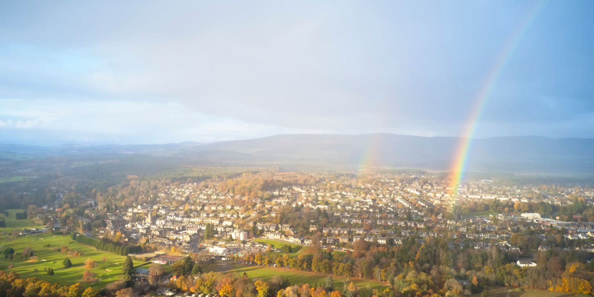 double rainbow over a town