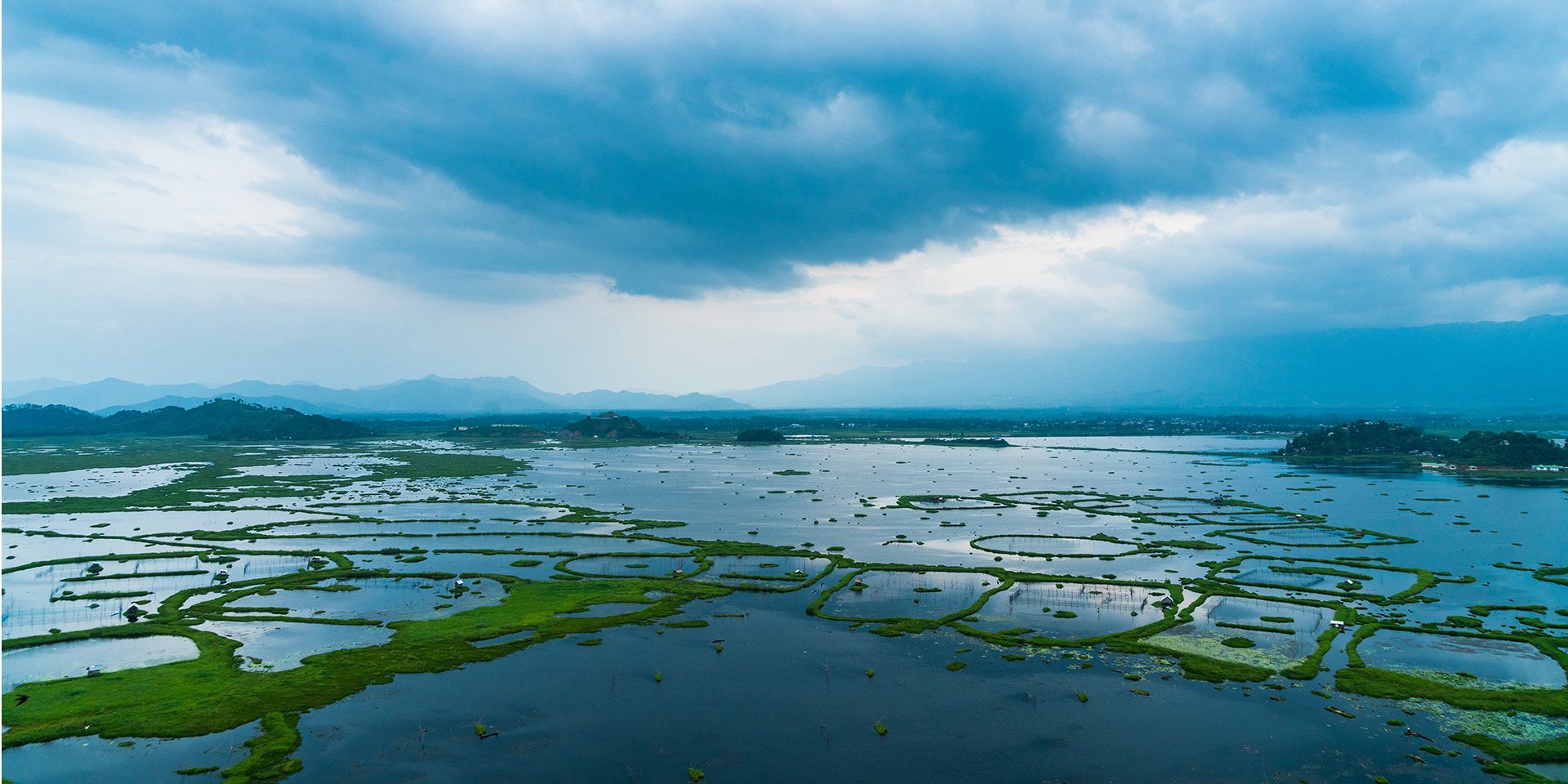 floating-islands-of-plants-in-loktak-lake-manipur-india-during-monsoon-season.shutterstock_677929075