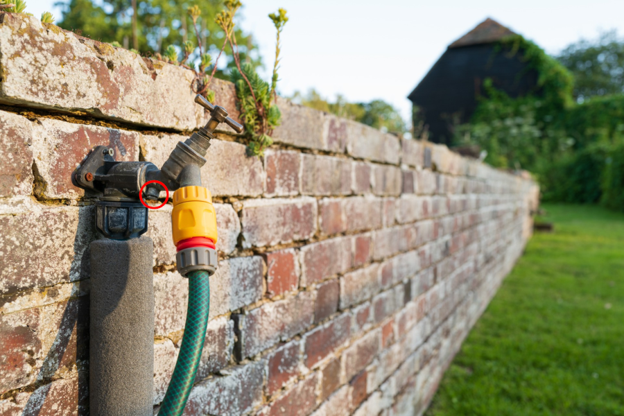 Garden tap with double check valve indicated by the red circle