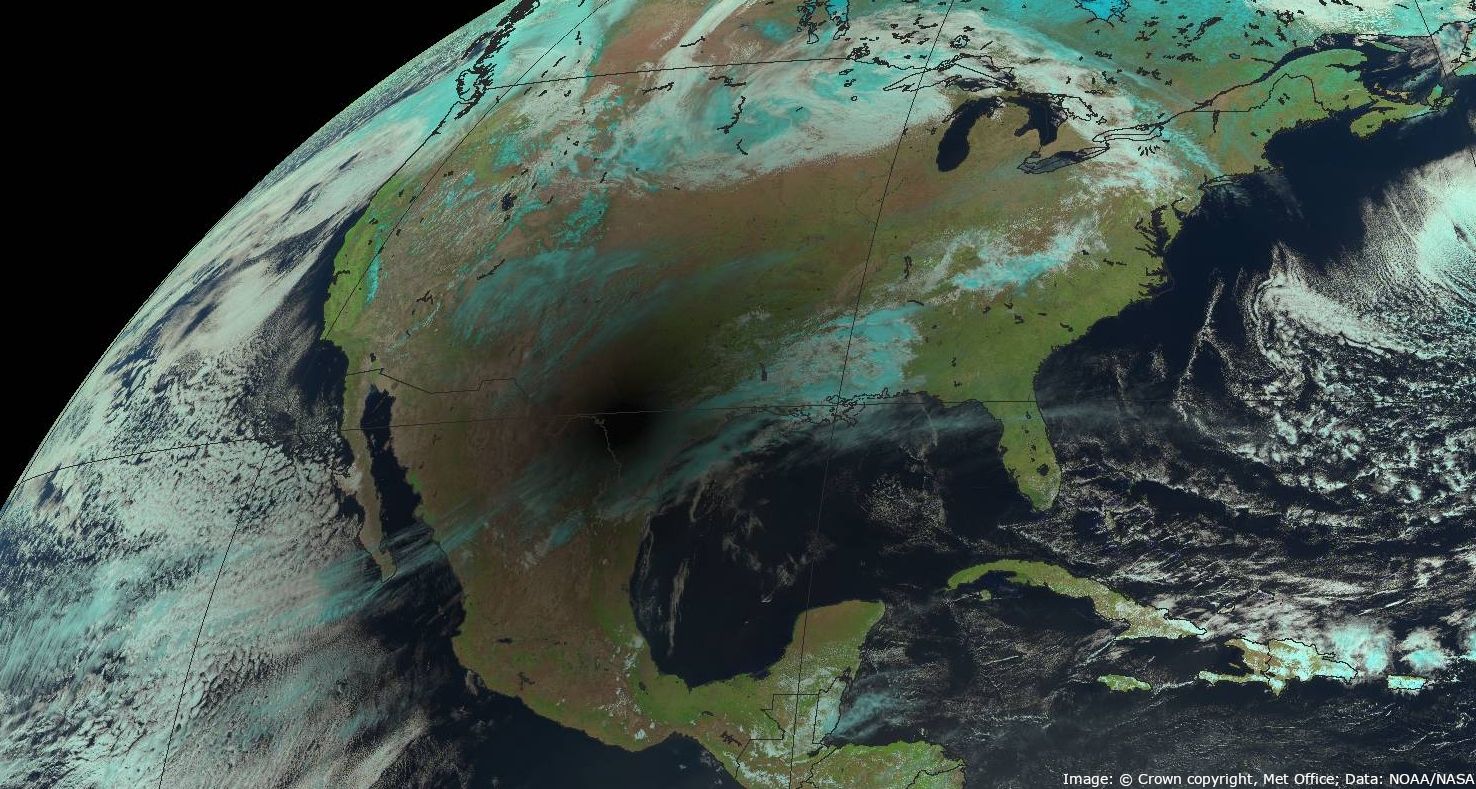 Geostationary satellite image showing dark spot of solar eclipse over North America