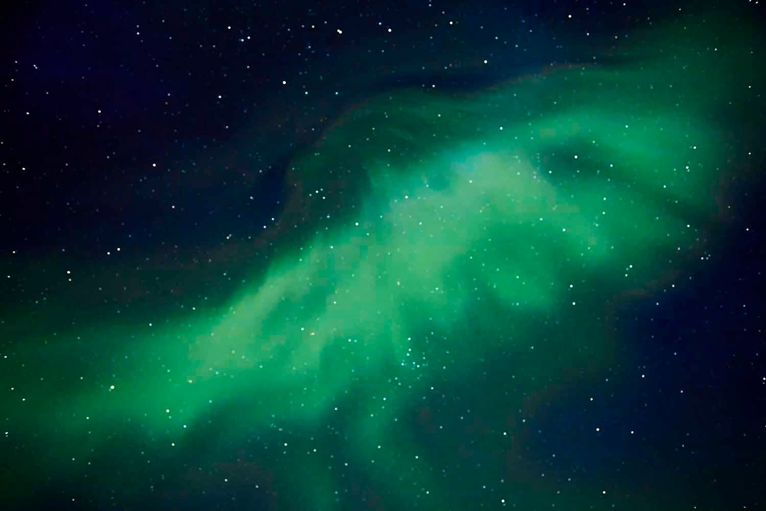 A starry night sky with the Aurora Borealis.