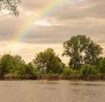 heavy-rain-and-rainbow-over-a-river