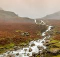 heavy-rain-causing-streams-of-water-running-of-the-lake-district-fells_adobestock_477491835