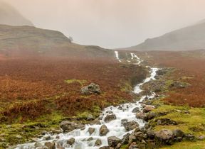 heavy-rain-causing-streams-of-water-running-of-the-lake-district-fells_adobestock_477491835