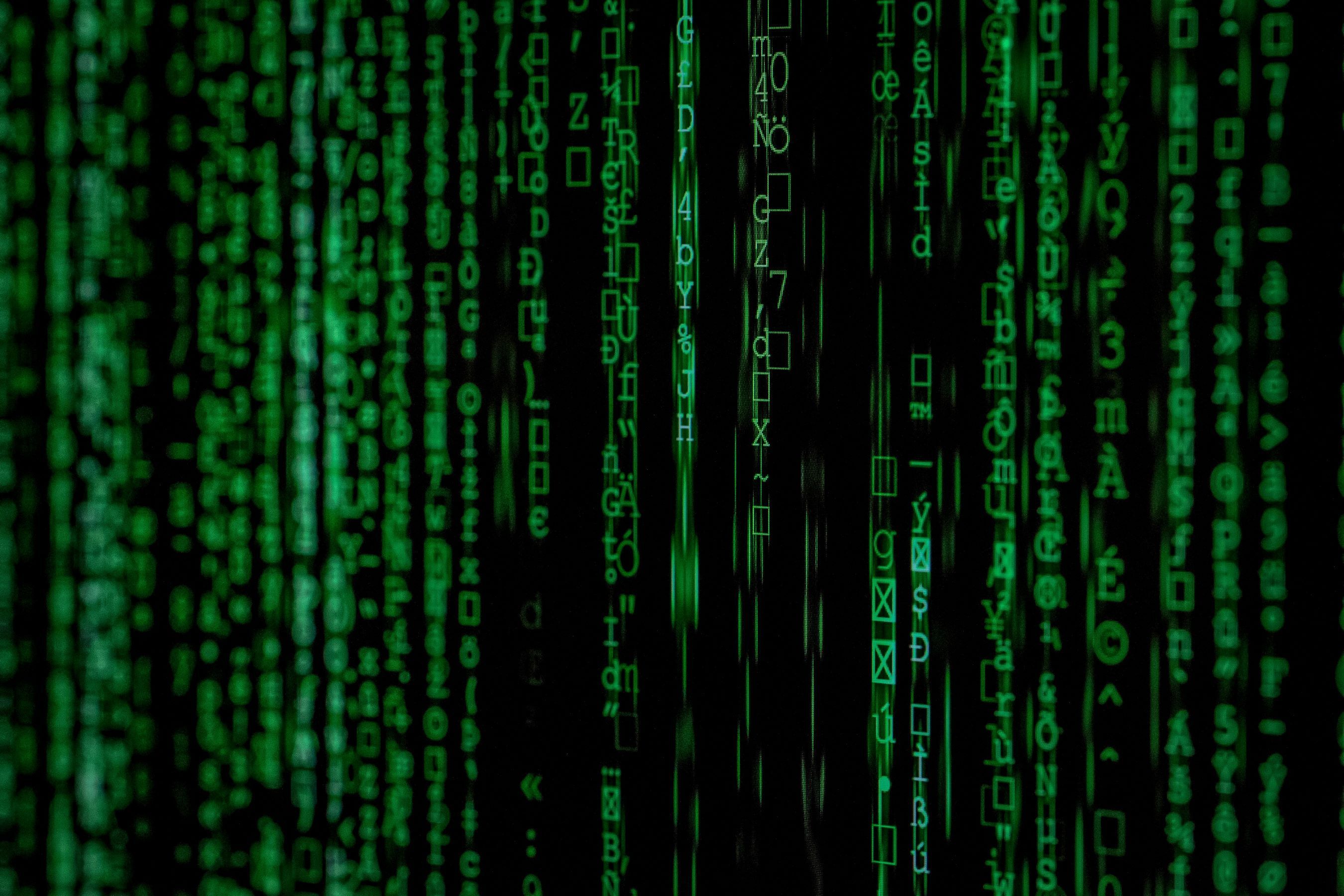 Lines of code in green running down the image. 