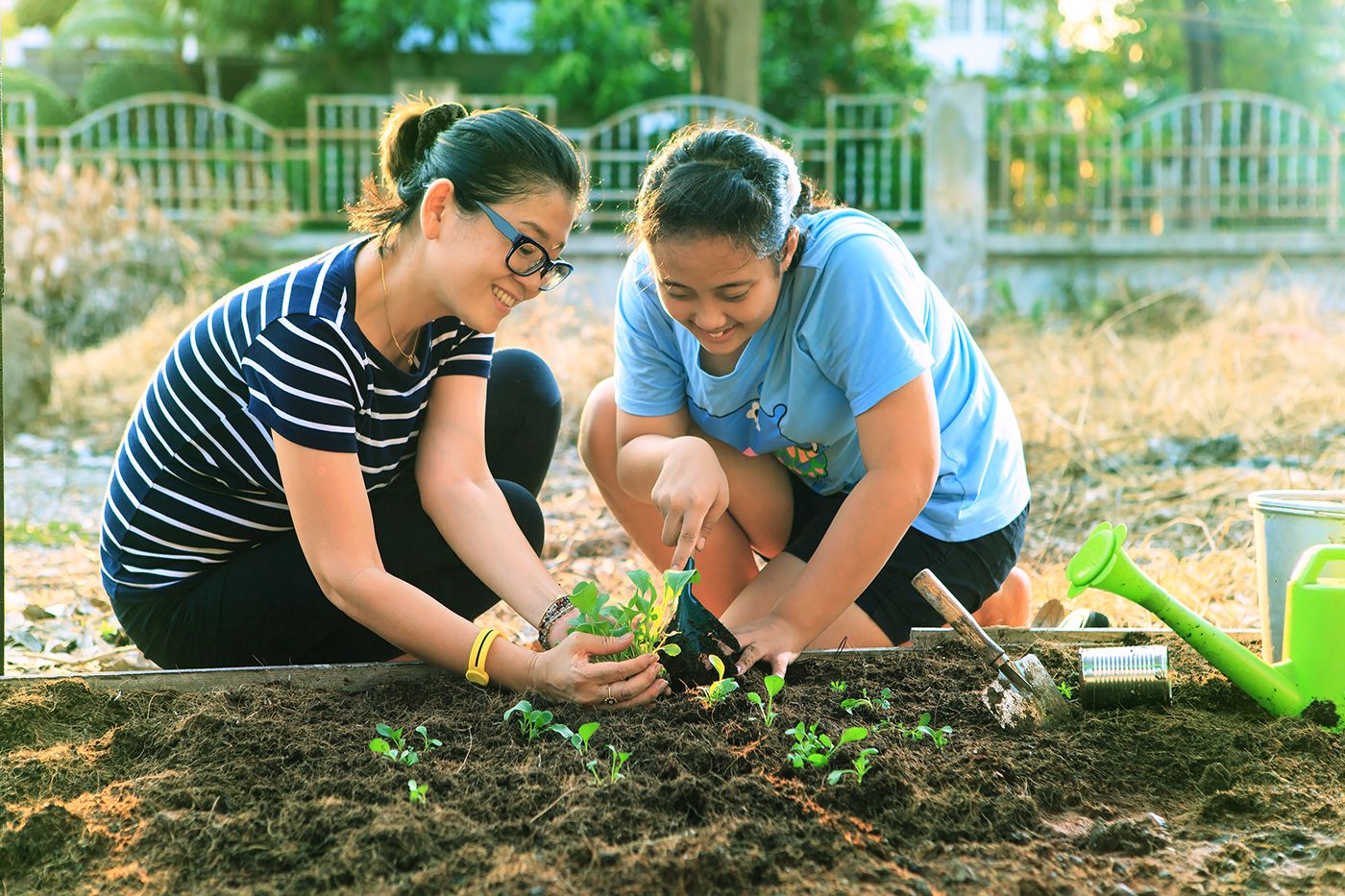 mother-and-daughter-gardening-together
