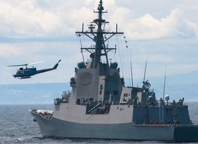 naval-ship-and-helicopter-on-sea