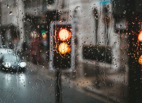 raindrops-on-window-blurred-traffic-background