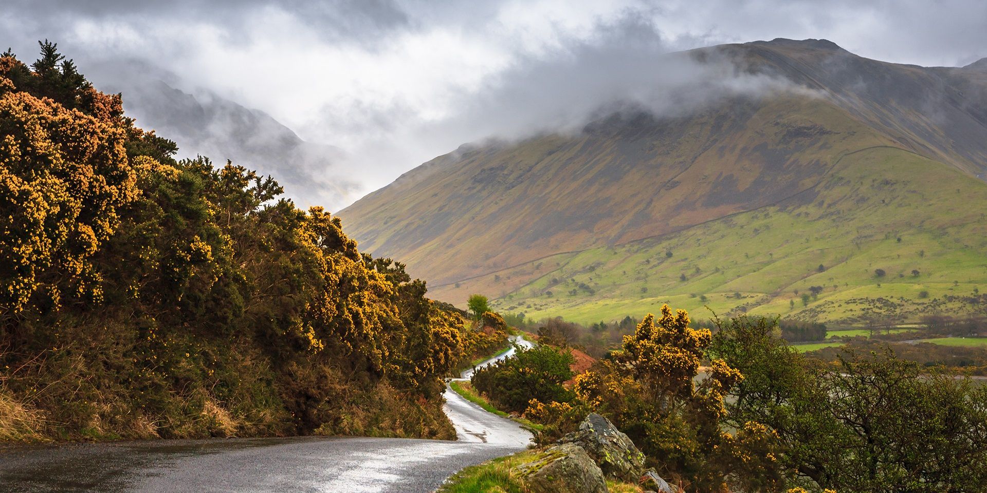 A road through a foggy valley