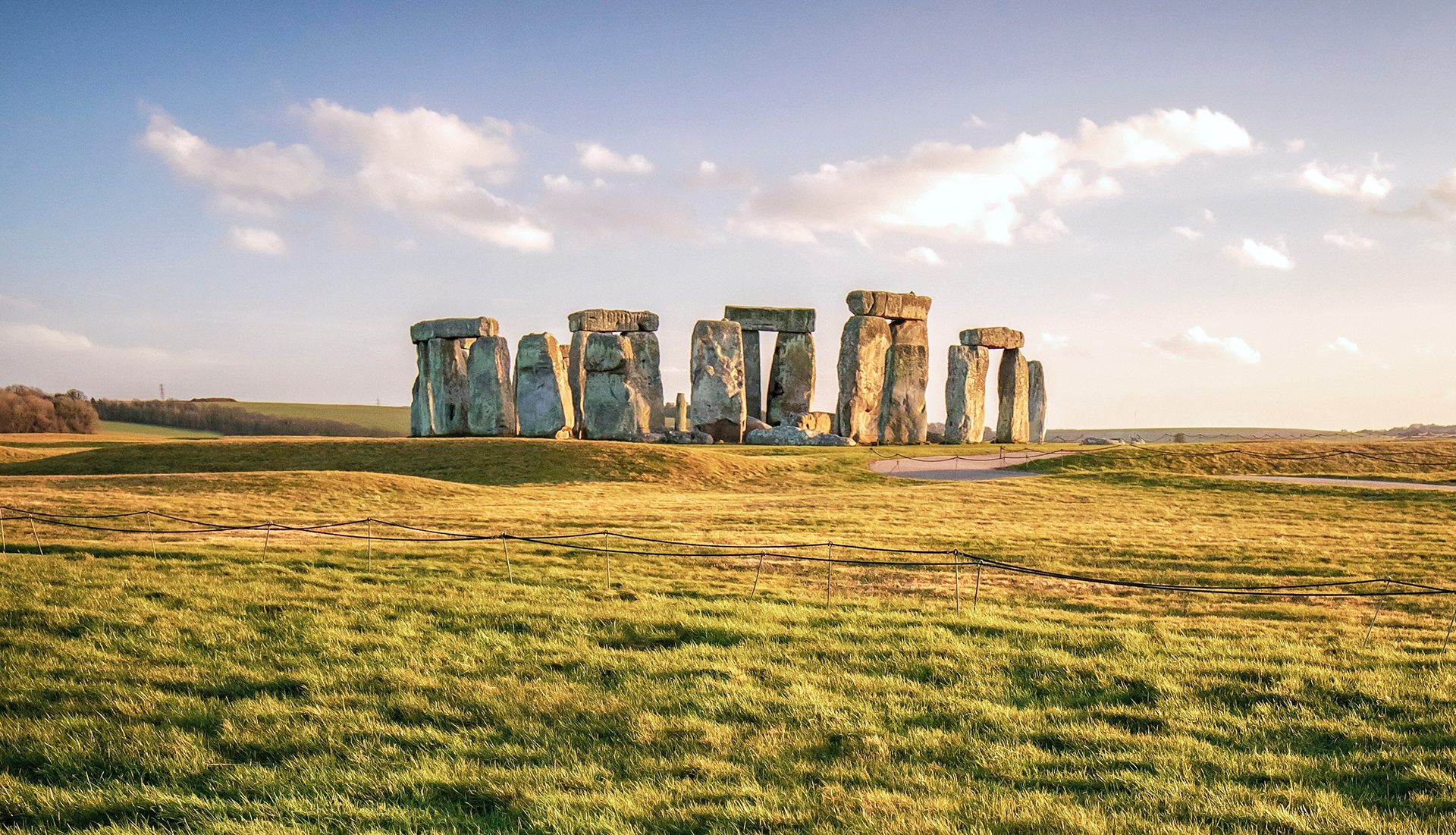 Stonehenge in the summer with blue skies and white cloud.