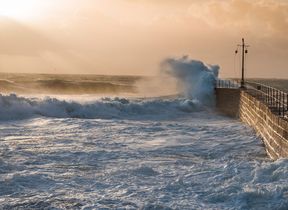 storm-waves-crashing-against-a-harbour-wall