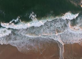 Hero: The shore line of a beach.