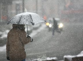 walking-in-the-snow-with-an-umbrella