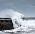 waves-crashing-against-a-harbour-wall