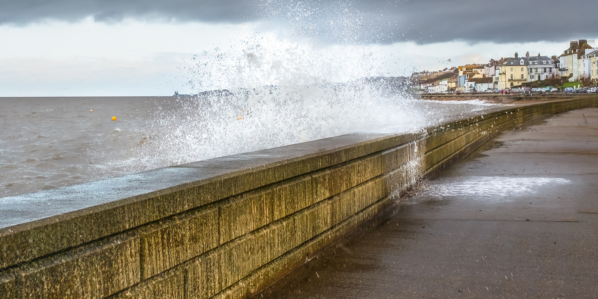 waves crashing on a sea wall