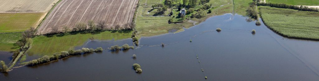 An aerial view of flooded fields and roads in England