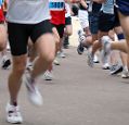 Legs of marathon runners in motion during a race