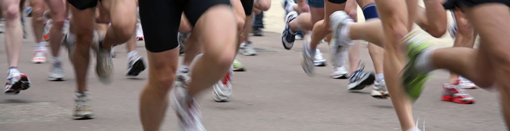 Legs of marathon runners in motion during a race