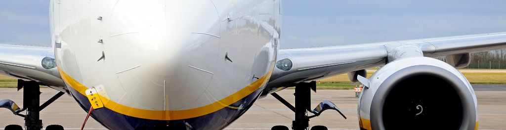 A plane being maintained on the runway of an airport.