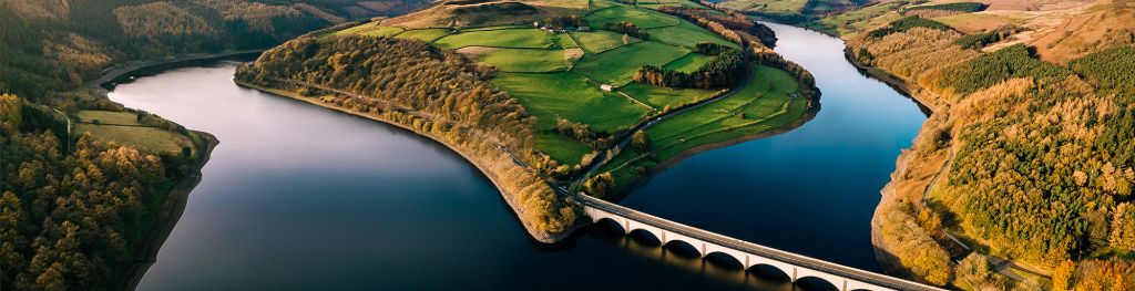 An island in the middle of a water reservoir relied to the mainland by a bridge