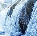 Waste water treatment plant. Modern urban wastewater treatment plant. Cold transparent water of decorative artificial waterfall