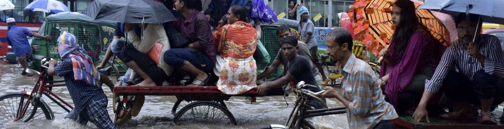 cyclists in Bangladesh monsoon