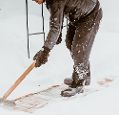 A man shovelling snow