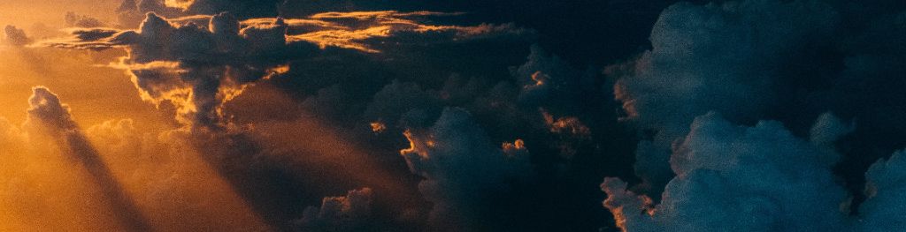 Crepuscular rays through a cloud sky Photo Tom Barrett