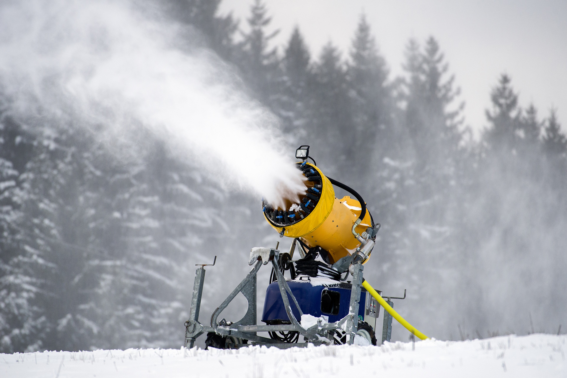 A snow cannon producing artificial snow.