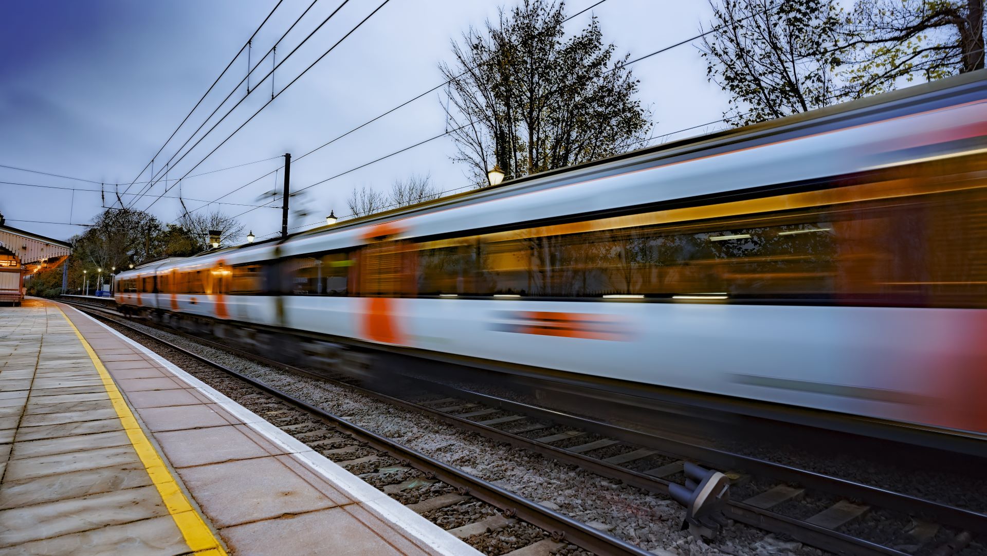 Train passing a train station.