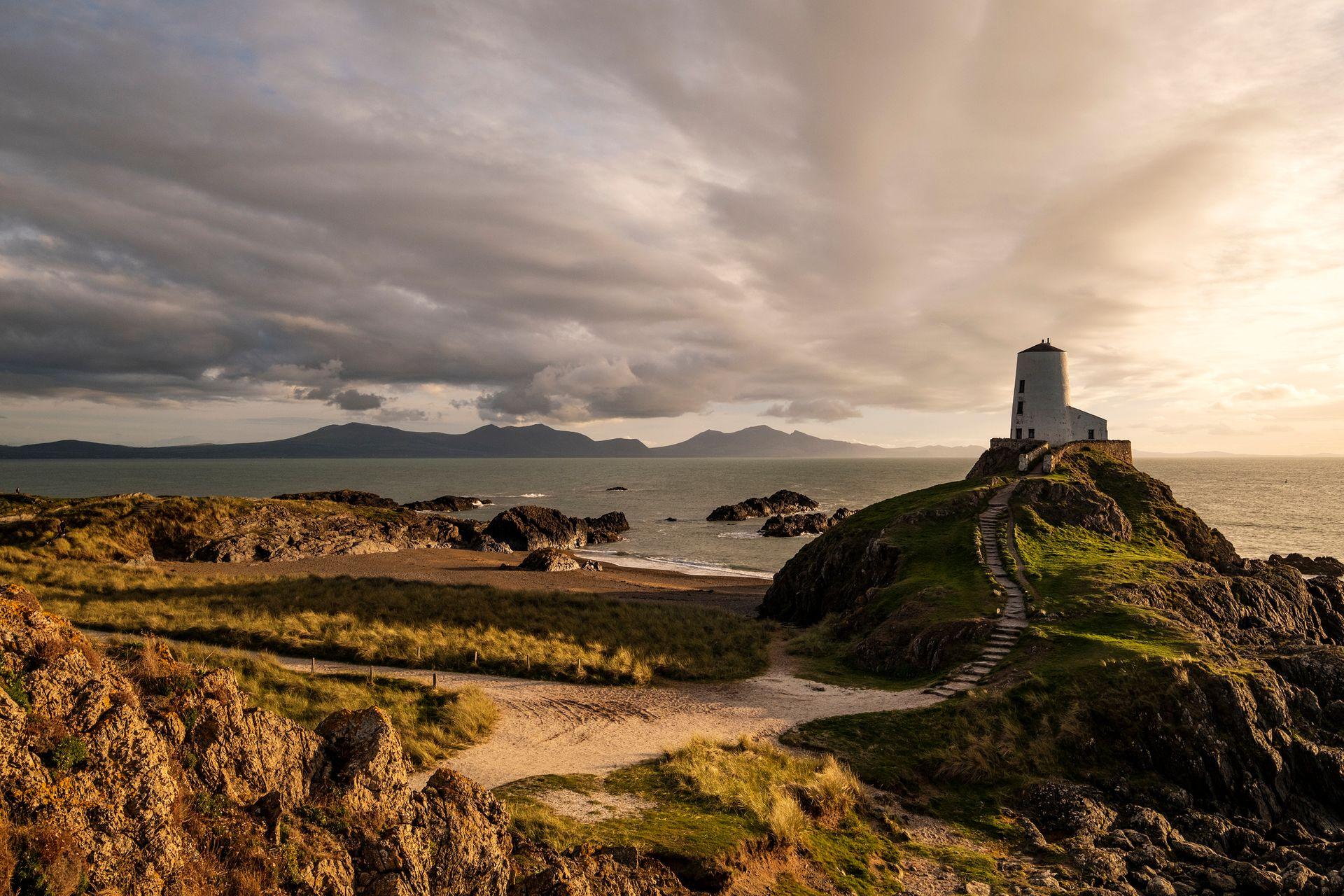 A Welsh coastal scene with a lighthouse.