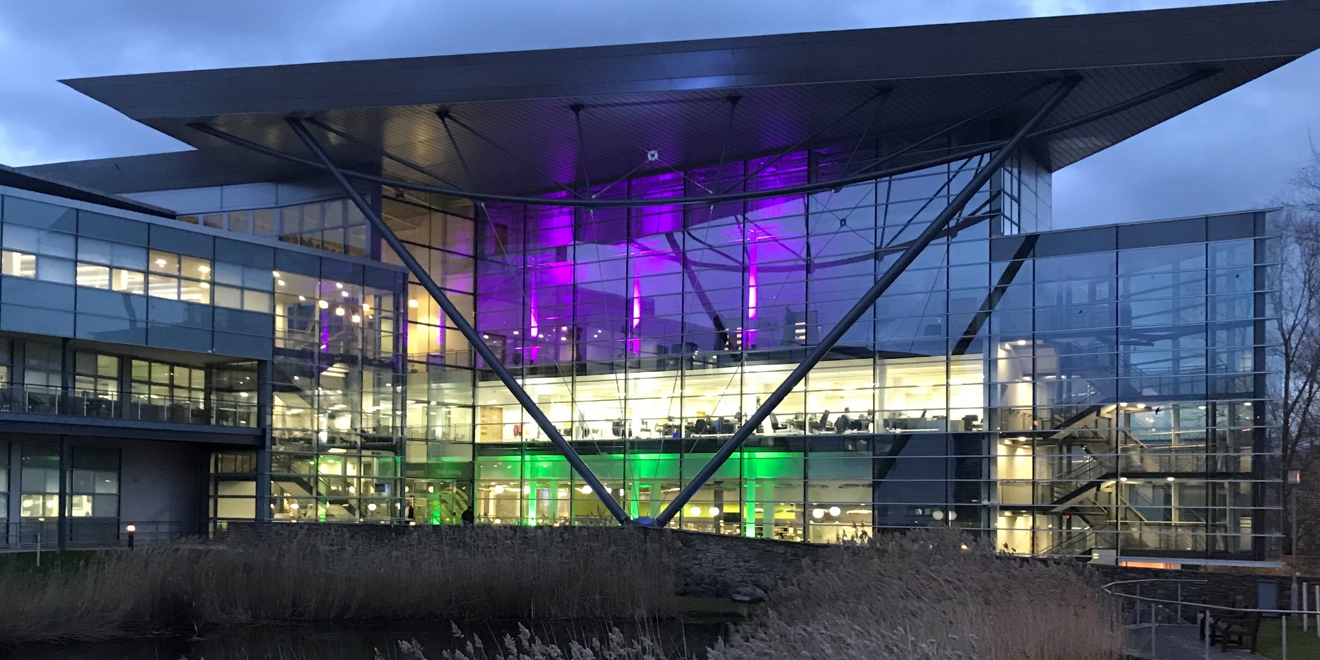 Met Office HQ at night with lights on.