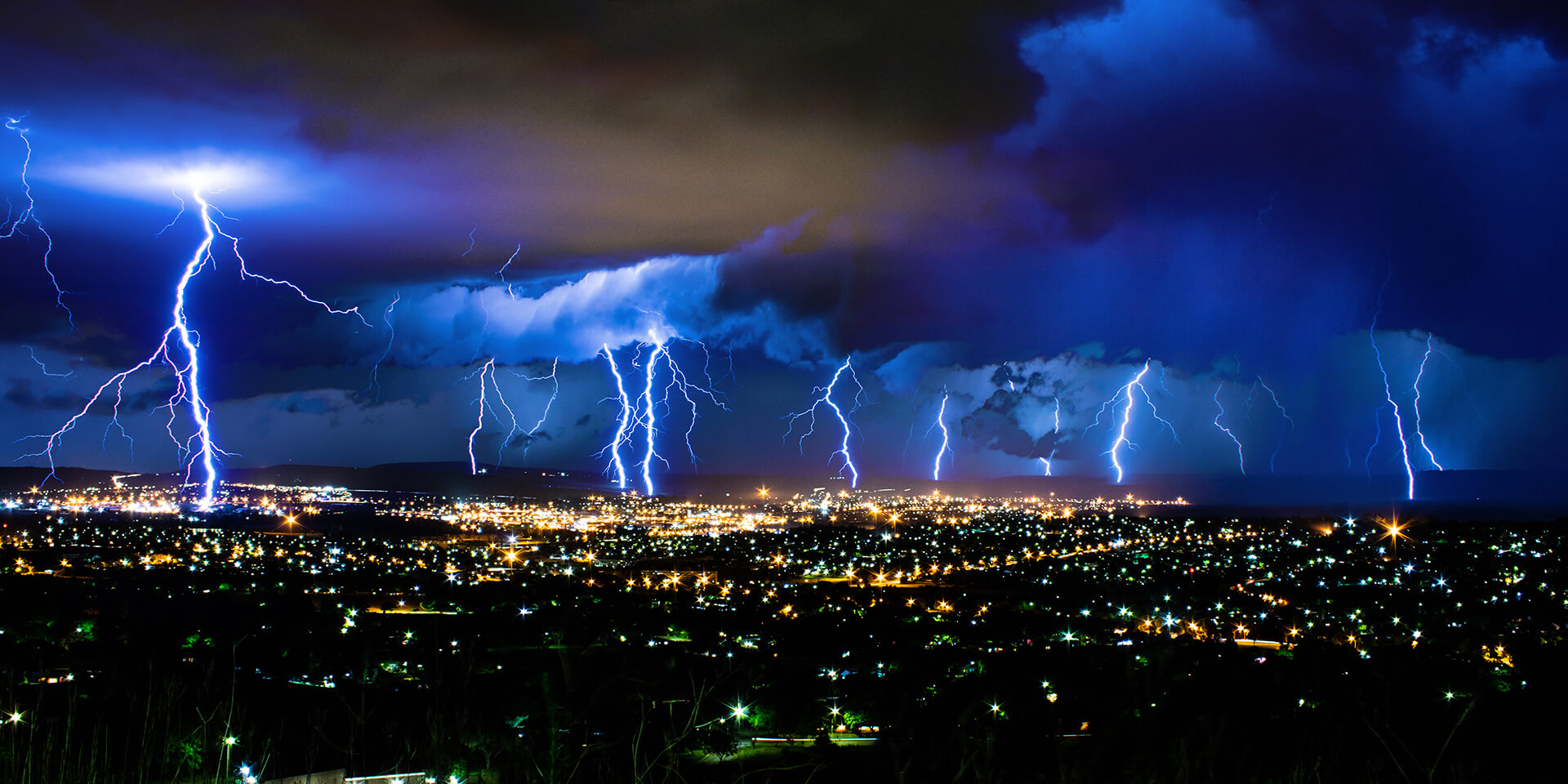 Decorative image showing a lightning storm in South Africa