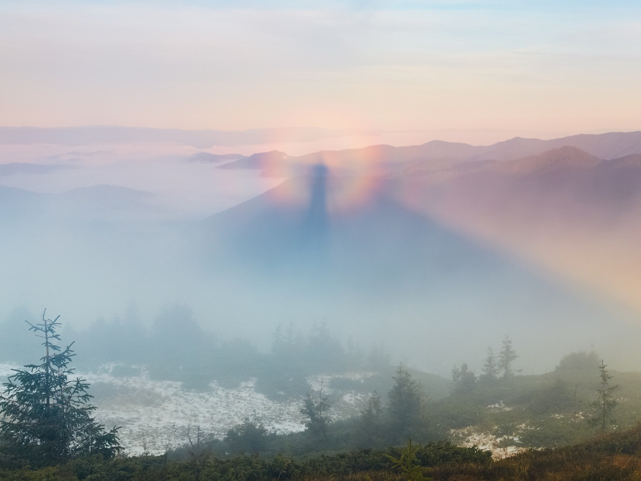 A brocken spectre, an optical illusion where an observer casts a shadow across the mist, giving the effect of a giant in the distance