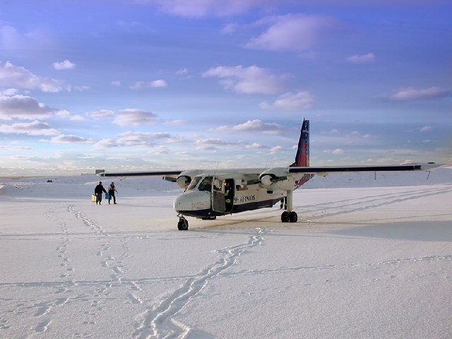 Plane on a snowy runway in Fair Isle
