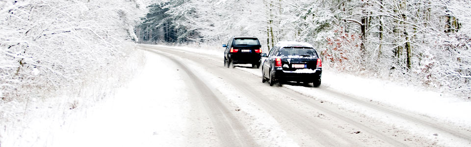 Cars struggling to drive in winter snow