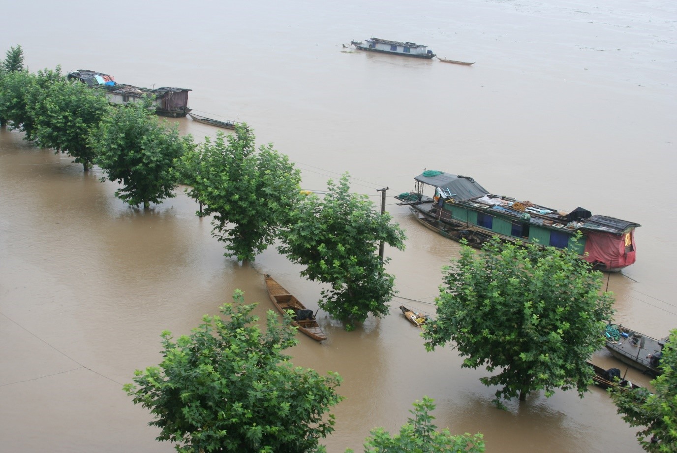 Flooding in Southern China. Trees and house boats surrounded by water